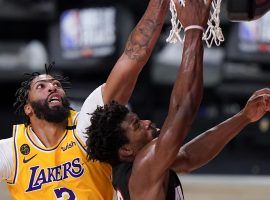 Anthony Davis of the LA Lakers attempts to block Miami Heat guard Jimmy Butler in Game 4. (Image: Mark J. Terrill/AP)