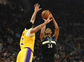 LA Lakers Anthony Davis defends a 3-point shot from Milwaukee Bucks center Giannis 'Greek Freak' Antetokounmpo in Milwaukee, WI. (Image: Stacey Revere/Getty)