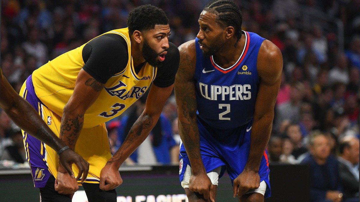 LA Lakers center, Anthony Davis, boxes out LA Clippers forward, Kawhi Leonard, in a game at Staples Arena in Los Angeles. (Image: Brian Rothmuller/Getty)