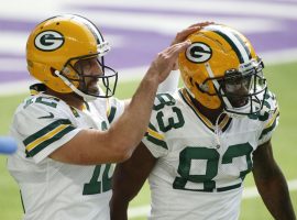 Green Bay Packers QB Aaron Rodgers congratulates WR Marquez Valdes-Scantling after a touchdown in 2019. (Image: Bruce Kluckjohn AP)