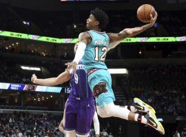 Memphis Grizzlies rookie sensation, Ja Morant, tomahawks a dunk against the Charlotte Hornets. (Image: Karen Pulfer Focht/AP)