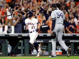 Houston Astros 2B Jose Altuve rounds the bases after hitting a walk-off home run off NY Yankees pitcher Aroldis Chapman (right) to win the 2019 ALCS. (Image: Elsa/Getty)