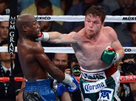 Canelo Alvarez (right) says he would be up for a rematch with Floyd Mayweather (left), though there havenâ€™t been any talks between the two fighters. (Image: Ethan Miller/Getty)