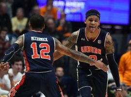 Auburn Tigers guards J'Von McCormmick (12) and Bryce Brown (2) celebrate after defeating Tennessee in the SEC tournament in Nashville, TN. (Image: Christopher Hanewinckel/USA Today Sports)