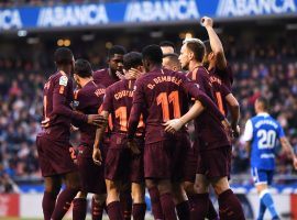 Barcelona players celebrate clinching the La Liga title after a 4-2 victory over Deportivo. (Image: Getty)