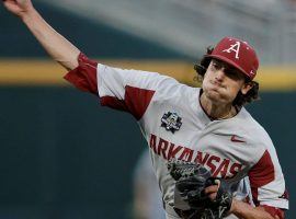 Arkansas pitcher Blaine Knight delivers a pitch against Oregon State in Game 1 of the 2018 College World Series. (Image: Nati Harnik/AP)