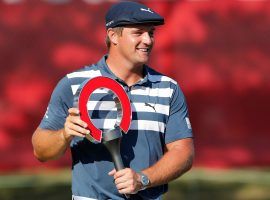 Bryson DeChambeau poses after winning the 2020 Rocket Mortgage Classic. Heâ€™ll look to repeat as champion at Detroit Golf Club this weekend. (Image: Carlos Osorio/AP)