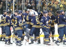 The Buffalo Sabres celebrate after winning their 10th consecutive game on Tuesday night. (Image: James McCoy/Buffalo News)