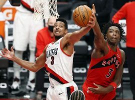 Portland Trail Blazers guard CJ McCollum, seen here driving by Toronto's OG Anunoby, suffered a foot injury that will keep him out for at least a month. (Image: Soobum Im/USA Today Sports)