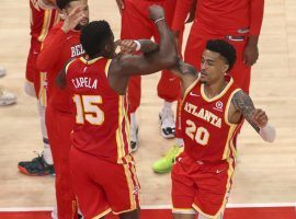 Clint Capela (15) and John Collins (20) dap it up during game introductions. (Image: Getty)