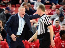 Chris Mullin, coach of St. John's, chats with an official during a game against Butler at Carnesecca Arena in Queens, NY. (Image: Steven Ryan/Getty)