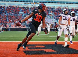 Oklahoma State running back Chuba Hubbard has been a beast this year, running for 1,726 yards and 20 touchdowns through 10 games. He'll be a key component of DFS lineups again this Saturday. (Image: Forbes)