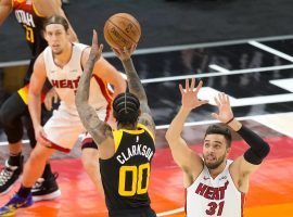 Utah Jazz guard Jordan Clarkson attempts a 3-pointer against the Miami Heat. The Jazz lost only one game since the first week of January. The red-hot Jazz covered the spread in seven-straight games. (Image: Lane Pryce/AP)