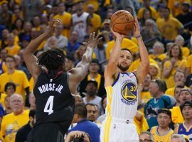 Stephen Curry from the Golden State Warriors taking a shot over the Houston Rockets Danuel House at Oracle Arena in Oakland, CA. Â (Image: Kyle Terada/Getty)