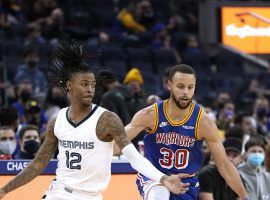 Steph Curry from the Golden State Warriors is defended by Ja Morant from the Memphis Grizzlies. (Image: Getty)