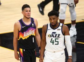 Phoenix Suns guard Devin Booker guards Donovan Mitchell of the Utah Jazz in a meeting between the top two teams in the NBA. (Image: Mark J. Rebilas/USA Today Sports)