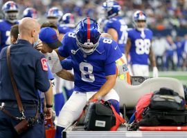 New York Giants quarterback Daniel Jones gets assistance to the medical cart after suffering a concussion and head injury against the Dallas Cowboys. (Image: Richard Rodriguez/Getty)