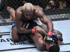 Derek Brunson (top) spent most of his fight with Kevin Holland (bottom) in dominant positions, and easily won a unanimous decision. (Image: Chris Unger/Zuffa/Getty)