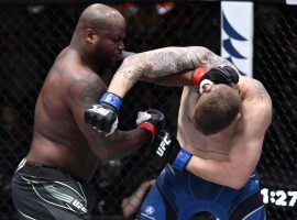 Derrick Lewis (left) stopped Chris Daukaus (right) in the first round to become the UFCâ€™s all-time knockout leader. (Image: Jeff Bottari/Zuffa)