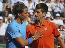 Rafael Nadal (left) and Novak Djokovic (right) talk after Djokovic’s win over Nadal in the quarterfinals of the 2015 French Open. (Image: AP)