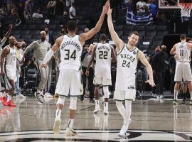 Giannis â€˜Greek Freakâ€™ Antetokounmpo and Pat Connaughton of the Milwaukee Bucks celebrate their series win in seven games against the Brooklyn Nets. (Image: Nathaniel S. Butler/Getty)