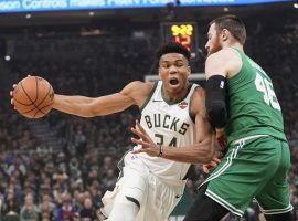 Giannis Antetokounmpo of the Milwaukee Bucks drives by Aron Baynes from the Boston Celtics in Game 5 of the Eastern Semifinals in Milwaukee, WI. (Image: Morry Gash/AP)