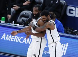 Kyrie Irving (right) hugs teammate James Harden after the Brooklyn Nets defeated the Oklahoma City Thunder in Oklahoma City. (Image: Alonzo Adams/USA Today Sports)