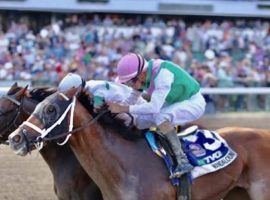 Hot Rod Charlie (back) finished ahead of Mandaloun by the proverbial nose in Saturday's Haskell Stakes. But the 4/5 favorite was taken down moments later for interfering with Midnight Bourbon. Mandaloun was declared the winner of his first Grade 1 amid questions about New Jersey's no-crop rule. (Image: Bill Denver/EQUI-SPORT)