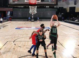 Gordon Hayward (20) of the Boston Celtics snatches a rebound against the Philadelphia 76ers in Game 1 of the NBA playoffs in Orlando, FL. (Image: Getty)