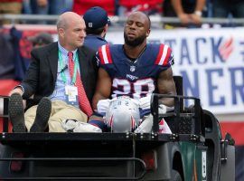 A dejected New England Patriots running back James White is carted off the field at Foxboro after a hip injury against the New Orleans Saints. (Image: Getty)