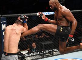 Jon Jones (right) won a controversial decision over Dominick Reyes (left) to retain his UFC light heavyweight title. (Image: Getty)