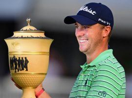 Justin Thomas holds the Gary Player Cup after his victory at the WGC-Bridgestone Invitational on Sunday. (Image: David Dermer/AP)