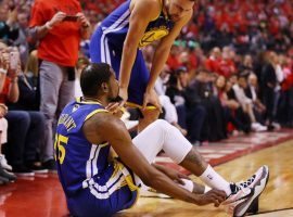 Kevin Durant of the Golden State Warriors falls to the court after re-injuring his lower leg in Game 5 of the NBA Finals against the Toronto Raptors in Toronto, Canada. (Image: Gregory Shamus/Getty)