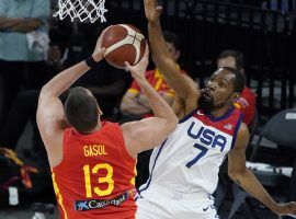 Kevin Durant from Team USA defends Marc Gasol from Spain in the final exhibition game in Las Vegas before both teams headed to Japan for the Tokyo Olympics. (Image: John Locher/AP)