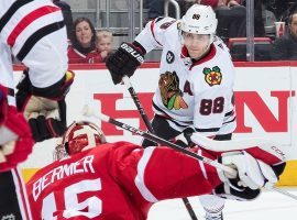 Patrick Kane from the Chicago Blackhawks shooting against Detroit Red Wings goalie Jonathan Bernier. (Image: Dave Reginek/Getty)