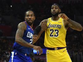 LA Clippers forward Kawhi Leonard guards LA Lakers forward LeBron James on opening night at Staples Center in Los Angeles. (Image: Sandy Hooper/USA Today Sports)