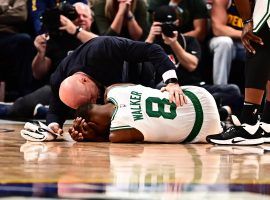 Boston Celtics medical staff attended to guard Kemba Walker after a collision with a teammate against the Denver Nuggets at the Pepsi Center in Denver, Co. (Image: Ron Chenoy/USA Today Sports)