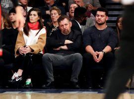 Billionaire James Dolan slumps in his courtside seat at Madison Square Garden during a Knicks games in 2019. (Image: Frank Franklin II/AP)