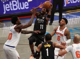 Kyrie Irving from the Brooklyn Nets drives the lane against Julius Randle of the New York Knicks at Madison Square Garden. (Image: Al Bello/Getty)