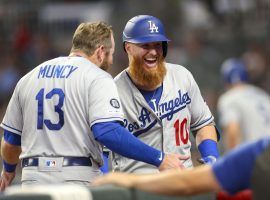 LA Dodgers 2B Max Muncy congratulates 3B Justin Turner after a victory over the Atlanta Braves. (Image: Brett Davis/USA Today Sports)