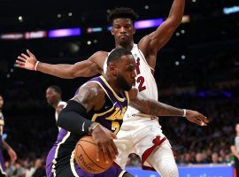 LeBron James of the LA Lakers drives against Miami Heat guard Jimmy Butler during a 95-80 victory at Staples Center in Los Angeles. (Image: Sean M. Haffey/Getty)