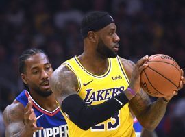 LA Clippers forward Kawhi Leonard (left) guards LA Lakers star LeBron James during a Christmas evening game in Los Angeles. (Image: Porter Lambert/Getty)