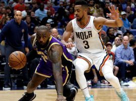 LeBron James from the LA Lakers slips while trying to drive by CJ McCollum of the New Orleans Pelicans. (Image: Sean Gardner/Getty)