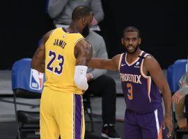 Chris Paul (right) from the Phoenix Suns guards LeBron James of the Los Angeles Lakers during the first round of the 2021 Western Conference playoffs. (Image: Getty)