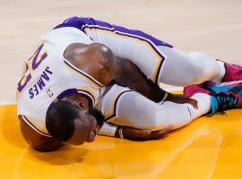 LA Lakers star LeBron James clutches his leg after suffering an ankle injury against the Atlanta Hawks. (Image: Joel Smith/Getty)