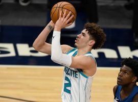 LaMelo Ball of the Charlotte Hornets shoots a jumper while Anthony Edwards of the Minnesota Timberwolves looks on. (Image: Getty)