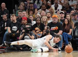 Luka Doncic from the Dallas Mavs stumbles in his pursuit for a loose ball against the Phoenix Suns in Game 5 at the Footprint Center. (Image: Getty)