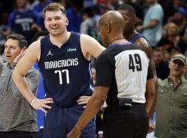 Luka Doncic from the Dallas Mavs kvetches with official Tom Washington after a no-call against the Portland Trail Blazers. (Image: Getty)