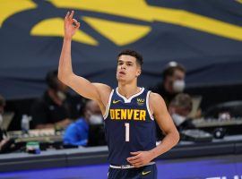 Michael Porter, Jr. celebrates hitting a 3-pointer in a recent victory for the Denver Nuggets at the Pepsi Center. (Image: Porter Lambert/Getty)