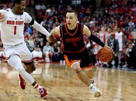 Bucknell senior guard Kimball Mackenzie drives by an Ohio State defender at Value City Arena in Columbus, Ohio. (Image: Bucknell Athletics)